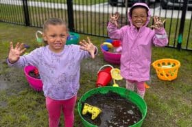 Children playing in Nature Explore Certified outdoor classroom at New Horizon Academy in Rosemount, Minnesota